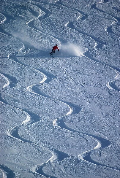 Skiers in powder snow