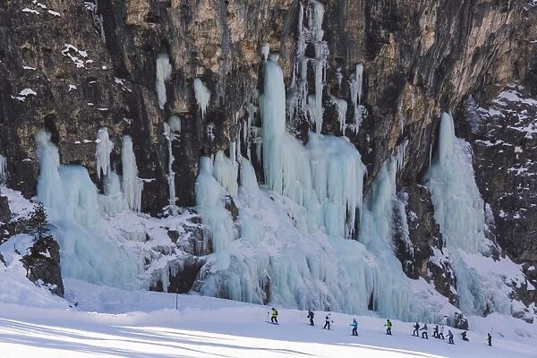 Skiers underneath the frozen waterfall, Hidden Valley ski area, Lagazuoi, Armentarola 101