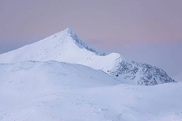Skredfloget mountain peak at dusk in winter, Senja, Troms og Finnmark county, Norway, Scandinavia, Europe