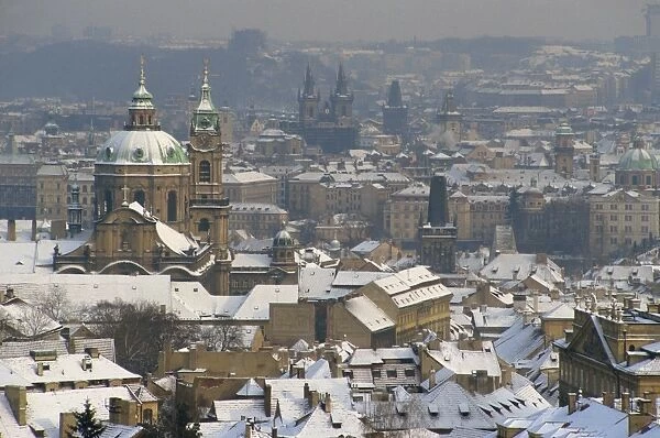 Skyline of the city of Prague in the winter, with snow on the roofs, Czech Republic
