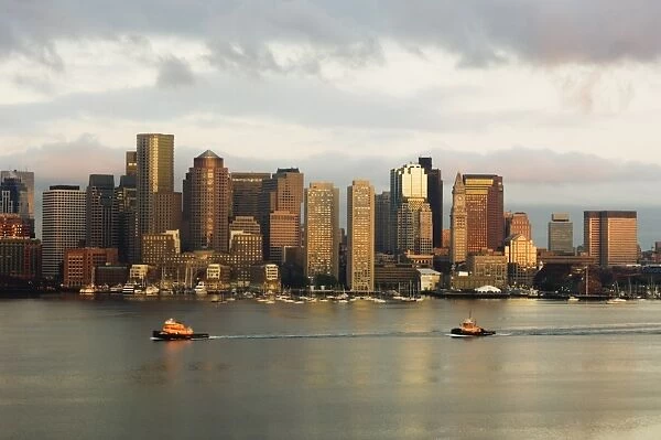 The skyline of the Financial District across Boston Harbor at dawn