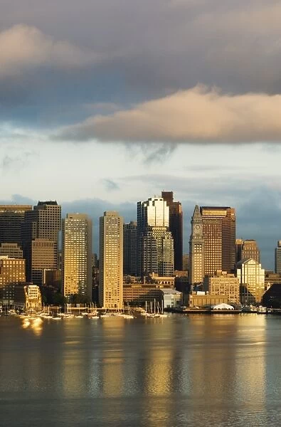 The skyline of the Financial District across Boston Harbor at dawn