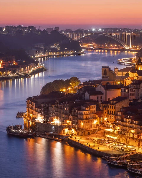 Skyline of the historic city of Porto at sunset with the bridge Ponte de Arrabida in the background, Portugal, Europe