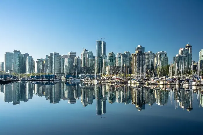 Framed Print : Skyline of Vancouver, with perfect reflection of skyscrapers in the blue waters of Stanley Park, Vancouver, British Columbia, Canada, North America Framed Print : Skyline of Vancouver, with perfect reflection of skyscrapers in the blue waters of Stanley Park, Vancouver, British Columbia, Canada, North America