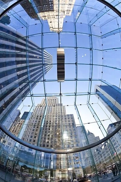 Skyscrapers of Fifth Avenue viewed from below through a glass roofed ceiling