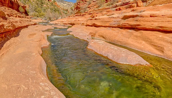 Slick rock water channel in Slide Rock State Park where most swimmers begin their slide