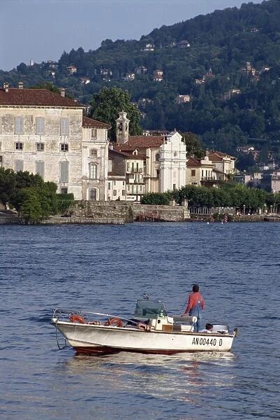 Small boat on Lake Maggiore with Isola Bella beyond