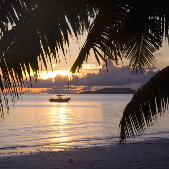 Framed Print : Small boat moored off the beach at Anse Volbert at sunrise, Baie Sainte Anne district Framed Print : Small boat moored off the beach at Anse Volbert at sunrise, Baie Sainte Anne district