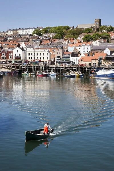 Small boat with outboard motor leaving the Harbour, Scarborough, North Yorkshire, Yorkshire, England, United Kingdom, Europe