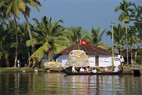 Small boat passing Communist flag
