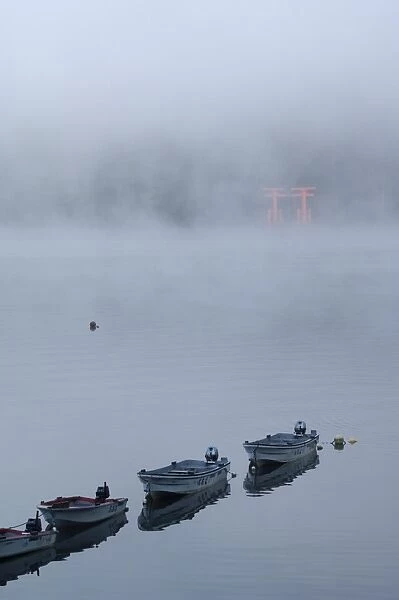Small boats in the mist on lake Ashi (Ashiko)