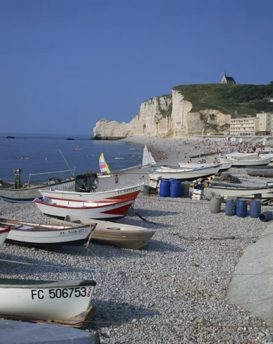 Framed Print : Small boats and people on the beach with cliffs in the background, at Etretat