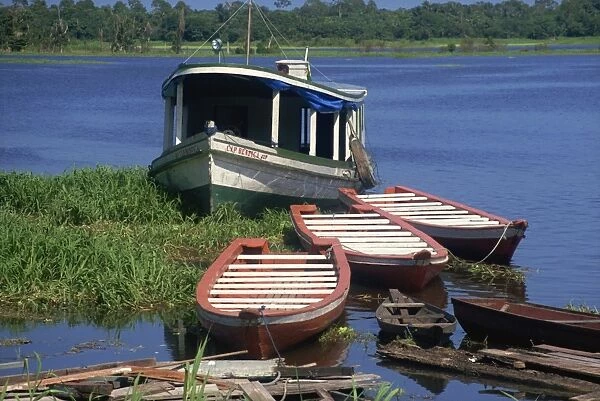 Small craft on tributary to Amazon near Manaus, Brazil, South America