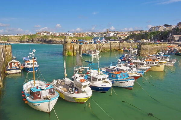 Small fishing boats in the harbour at high tide, Newquay, North Cornwall