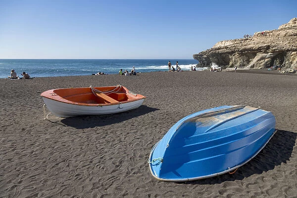 Small fishing boats on Playa Ajuy on the volcanic island of Fuerteventura, Canary Islands