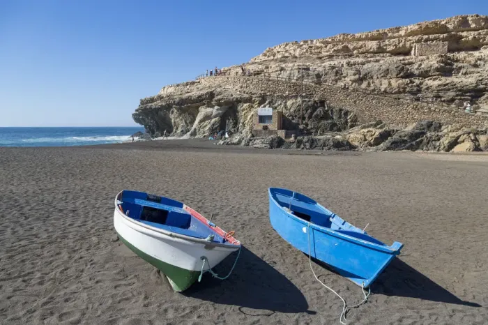 Framed Print : Small fishing boats on Playa Ajuy on the volcanic island of Fuerteventura, Canary Islands Framed Print : Small fishing boats on Playa Ajuy on the volcanic island of Fuerteventura, Canary Islands