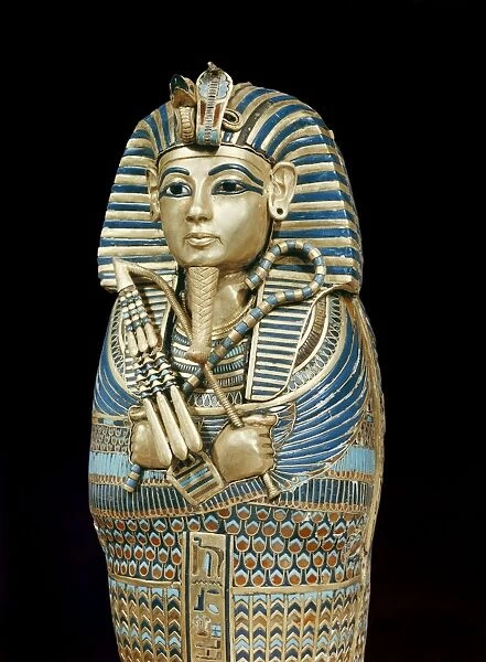 One of the four small gold mummiform coffins placed in the canopic urns
