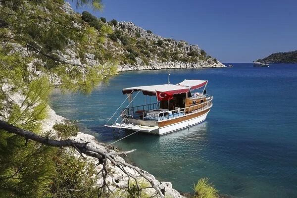 Small gulet boat in craggy cove, Kekova, near Kas, Lycia, Antalya Province, Mediterranean Coast, Southwest Turkey, Turkey, Asia Minor, Eurasia