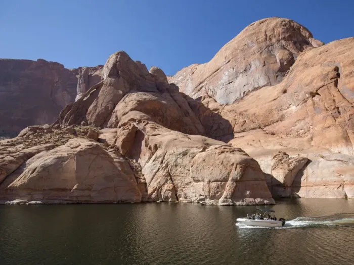 Framed Print : Small pleasure boat in Forbidding Canyon, a narrow arm of Lake Powell Framed Print : Small pleasure boat in Forbidding Canyon, a narrow arm of Lake Powell
