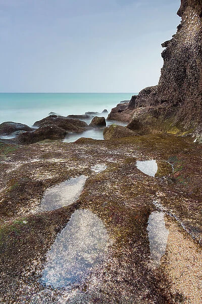 Small pool on coastline at turtle beach, Ras Al Jinz Turtle Reserve, Al Hadd, Oman, Middle East