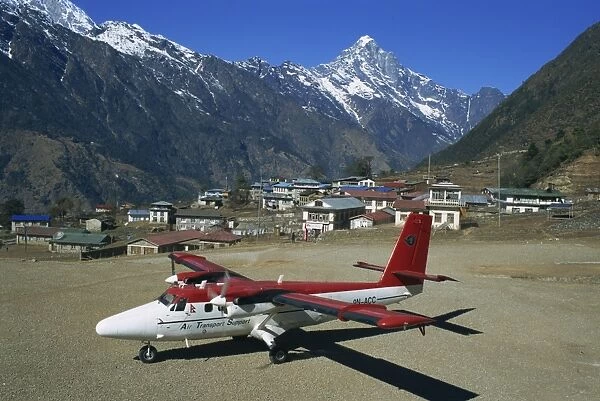 Small propellor aeroplane on the airstrip at Lukla