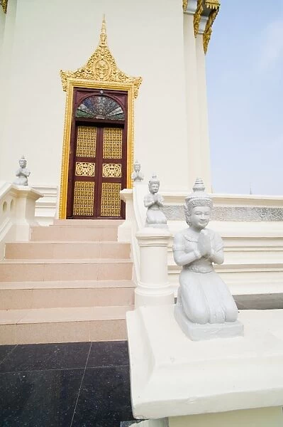 Small white Buddha statues at The Silver Pagoda (Temple of the Emerald Buddha), The Royal Palace, Phnom Penh, Cambodia, Indochina, Southeast Asia, Asia