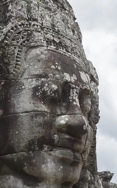 A smiling face carved in stone, Bayon, Angkor, UNESCO World Heritage Site, Siem Reap, Cambodia, Indochina, Southeast Asia, Asia