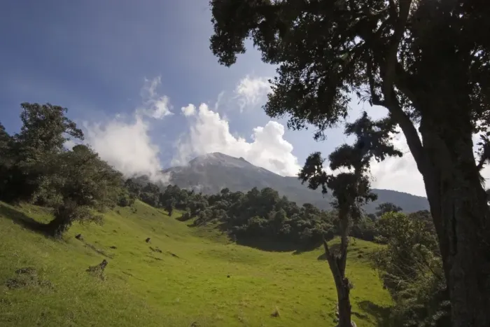 Framed Print : Smoke rises from the active crater of Tungurahua Volcano that threatens the nearby town of Banos Framed Print : Smoke rises from the active crater of Tungurahua Volcano that threatens the nearby town of Banos