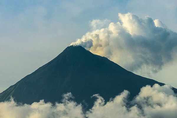Smoking Karangetang, an active Pacific Ring of Fire volcano, Karangetang, Siau Island, Sangihe Archipelago, Sulawesi, Indonesia, Southeast Asia, Asia