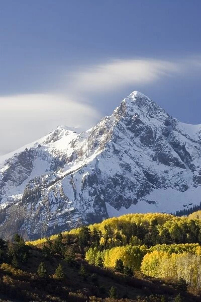 Snow capped mountain and fall colors