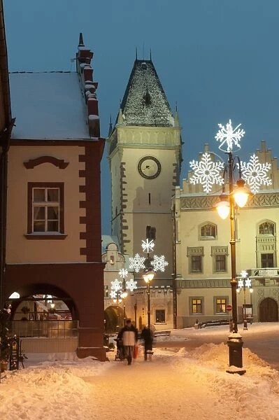 Snow-covered Christmas decorated lamps and Gothic Town Hall, Tabor, Jihocesky, Czech Republic, Europe