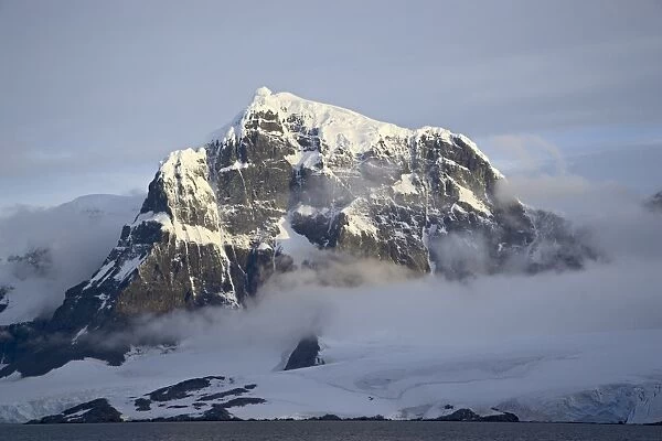 Snow covered coastal mountain, Wiencke Island, Antarctic Peninsula, Antarctica