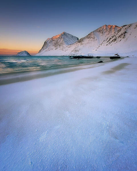 Snow covered Haukland Beach at sunset, Lofoten Islands, Nordland, Norway, Europe