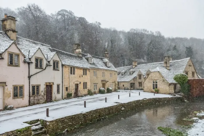 Framed Print : Snow covered houses by By Brook in Castle Combe, Wiltshire, England, United Kingdom Framed Print : Snow covered houses by By Brook in Castle Combe, Wiltshire, England, United Kingdom
