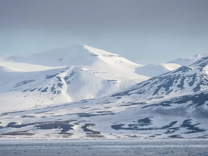 Framed Print : Snow covered mountains and bare rock on the coast of Spitsbergen, Storfjorden, Svalbard, Norway, Europe