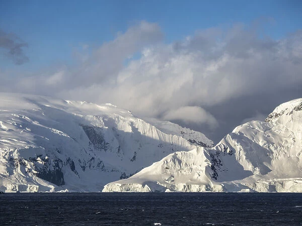 Snow-covered mountains on Danco Island, in front of the Antarctic Peninsula, Antarctica, Polar Regions