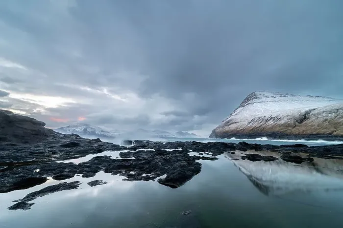 Framed Print : Snow covered mountains and rock pool reflections at low tide, Gjogv village, Eysturoy Island, Faroe Islands, Denmark, Europe Framed Print : Snow covered mountains and rock pool reflections at low tide, Gjogv village, Eysturoy Island, Faroe Islands, Denmark, Europe