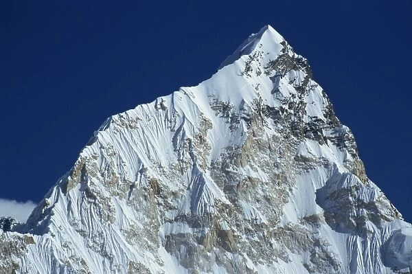 The snow covered Nuptse peak seen from Kala Patar in the Himalayas