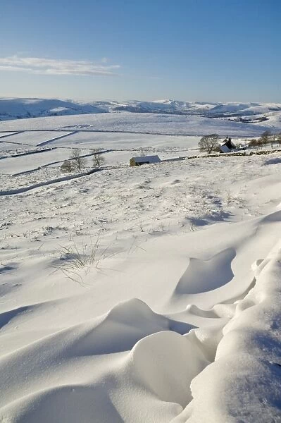 Snow drifts and snow covered moorland at Stanage Edge, Peak District National Park