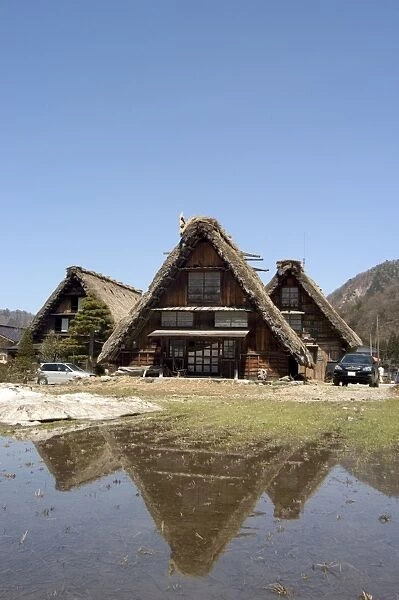 Snow melt, reflection of gasshou zukuri thatched roof houses