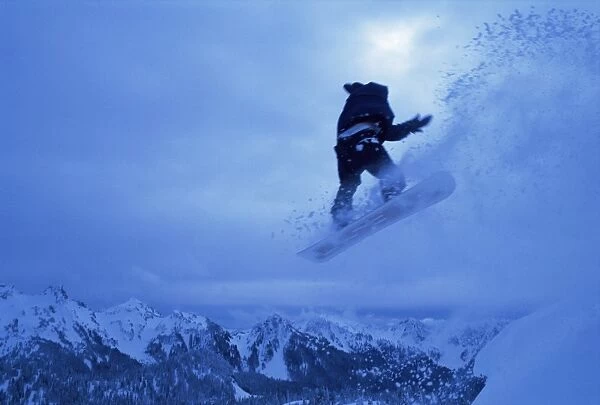 Snowboarder heads down