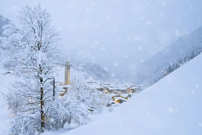 Framed Print : Snowflakes falling on mountain huts in the fairy tale alpine village at Christmas time Framed Print : Snowflakes falling on mountain huts in the fairy tale alpine village at Christmas time