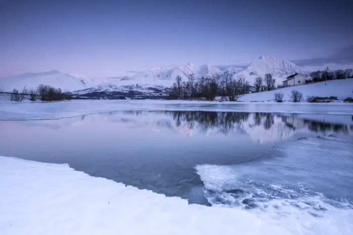 Framed Print : Snowy peaks are reflected in the frozen Lake Jaegervatnet at dusk, Stortind, Lyngen Alps Framed Print : Snowy peaks are reflected in the frozen Lake Jaegervatnet at dusk, Stortind, Lyngen Alps