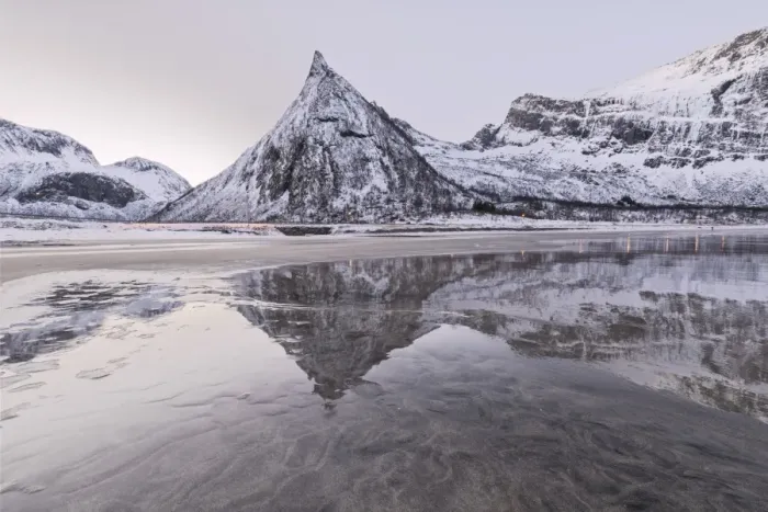 Framed Print : Snowy peaks reflected in the frozen sea surrounded by sandy beach at dawn, Ersfjord Framed Print : Snowy peaks reflected in the frozen sea surrounded by sandy beach at dawn, Ersfjord