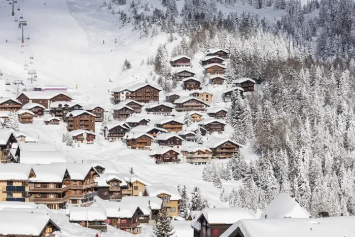 Framed Print : Snowy woods frame the typical alpine village and ski resort, Bettmeralp, district of Raron Framed Print : Snowy woods frame the typical alpine village and ski resort, Bettmeralp, district of Raron