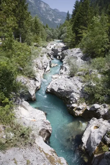 Framed Print : Soca River with clear emerald water flowing between Framed Print : Soca River with clear emerald water flowing between
