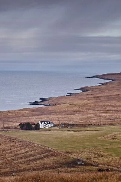 A solitary house sits on the north west coast of the Isle of Skye, Inner Hebrides, Scotland, United Kingdom, Europe