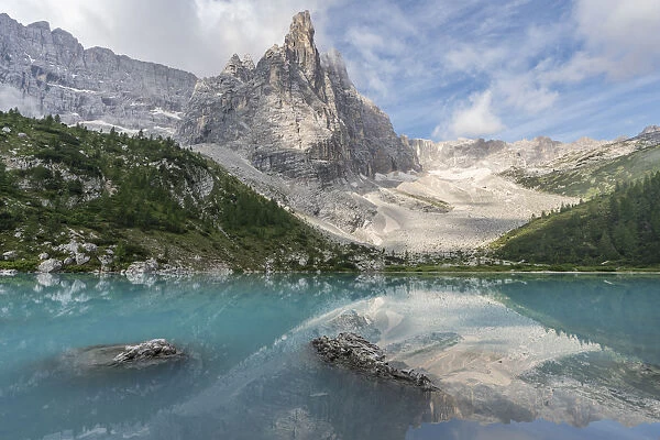 Sorapis Group with clouds and Sorapis Lake in summer. Cortina d Ampezzo, Belluno province