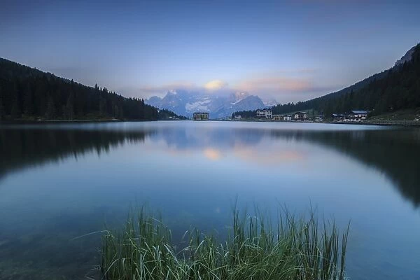 The Sorapiss mountain range is reflected in Lake Antorno at sunrise, Veneto Sesto Dolomites