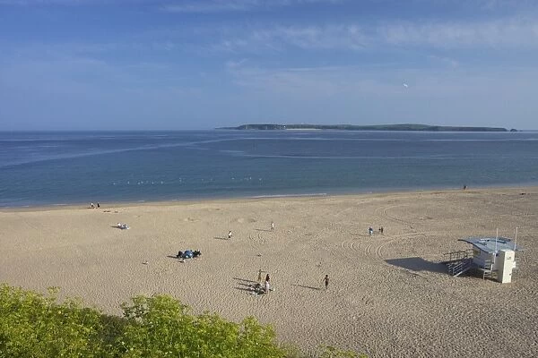 South beach looking to Caldy Island in summer sunshine, Tenby, Pembrokeshire National Park